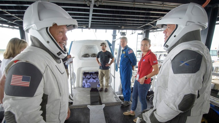 NASA astronauts Doug Hurley, left, and Bob Behnken work with teams from NASA and SpaceX to rehearse crew extraction.