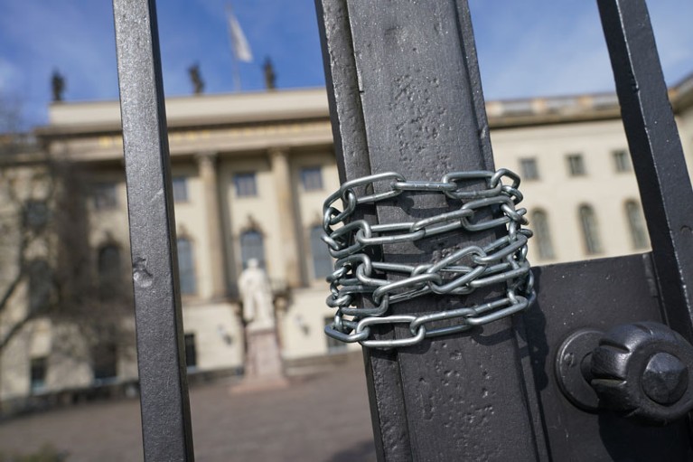Closeup of a chain around iron gates at the entrance of Humboldt University, Berlin.