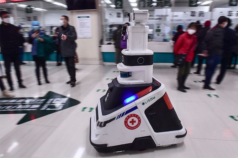 Photo of a patrol robot moving across the floor at a hospital in Shenyang, China