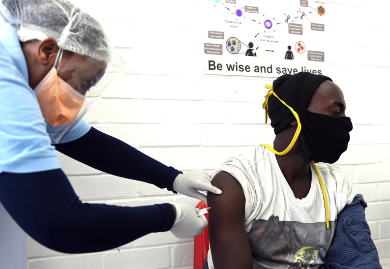 A volunteer receives an injection during the country's first human clinical for a potential vaccine against COVID-19 in Soweto.
