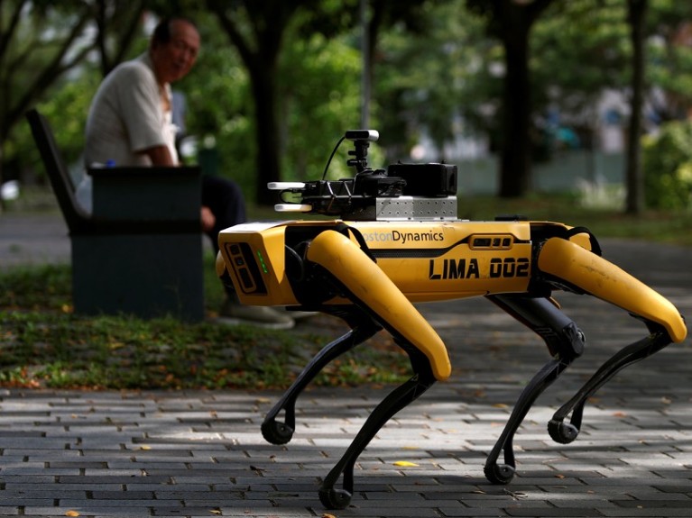 A four-legged robot dog called SPOT patrols a park, Singapore.