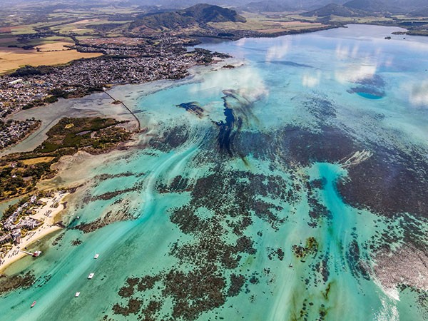 An aerial view of the MV Wakashio off the coast of south-east Mauritius and a large patch of leaked oil.