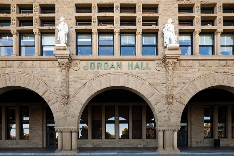 The facade of a building with arches, columns and statues, emblazoned with the name 'Jordan Hall'.