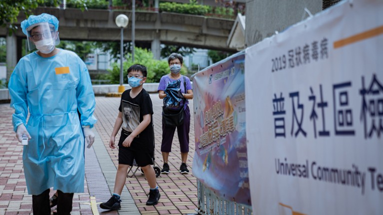 A medical staff dressed in a protective suit during the voluntary mass-testing programme for coronavirus, Hong Kong.