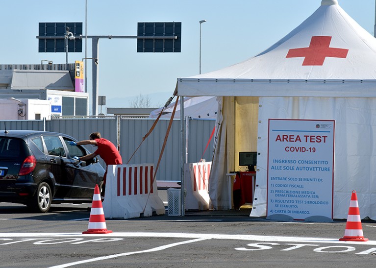 Medical staff attend the new COVID-19 drive-in test centre at Rome's Fiumicino Airport