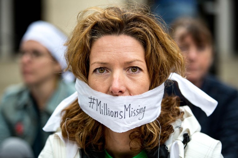 Close up of a woman's face protesting to raise awareness of the affect ME and Chronic Fatigue Syndrome has on daily life