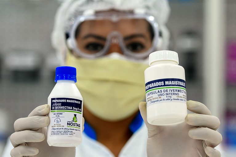 A pharmacist holds the anti-parasite drug ivermectin for sale in Bolivia
