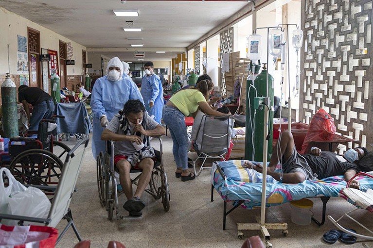 Doctors in biosecurity suits tend to patients with COVID-19 at the Regional Hospital of Iquitos, Peru