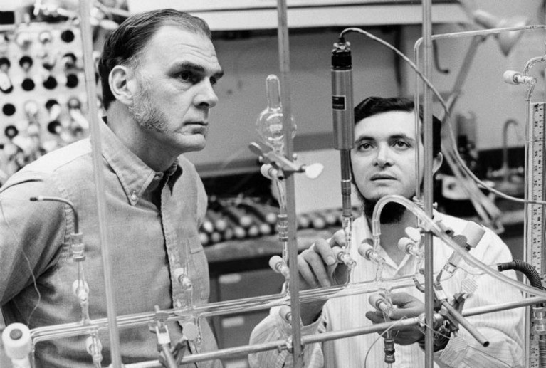 Mario Molina and FS Rowland looking at experimental equipment in a laboratory in in 1974