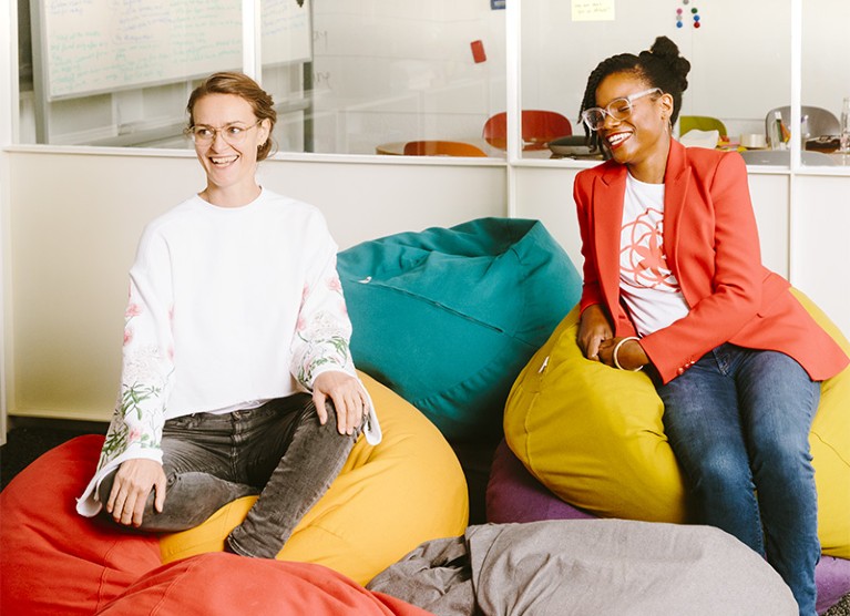 Ida Tin and Lynae Brayboy sit next to each other on coloured bean bags