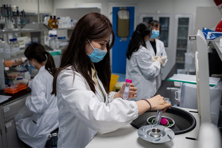 Engineers working on an experimental vaccine for COVID-19 at Sinovac Biotech in Beijing