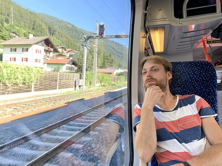 Milan Klöwer on a train through the Alps