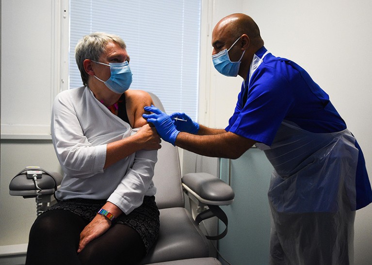 A Novavax vaccine trial with a patient and health care provider in London