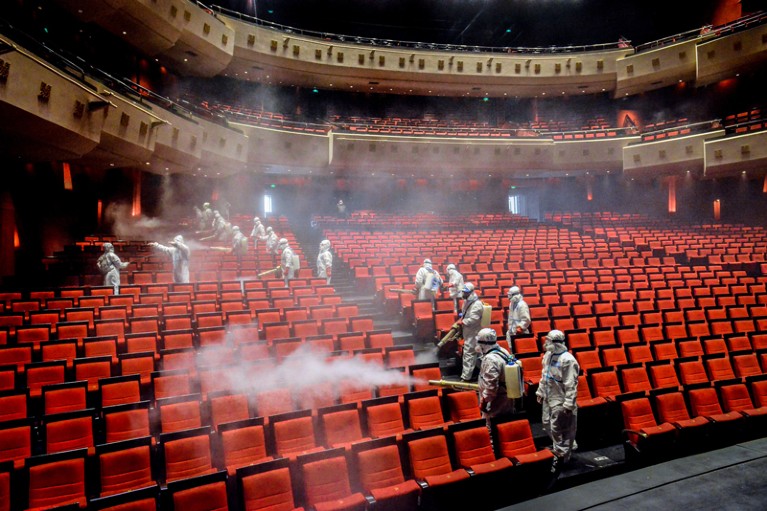 Members of Blue Sky rescue team disinfect Wuhan Qintai Grand Theatre
