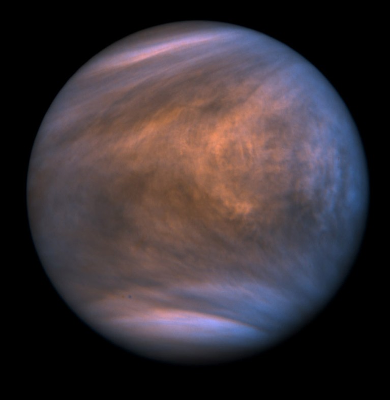 Image of planet Venus, with blue and grey clouds, against a black background.