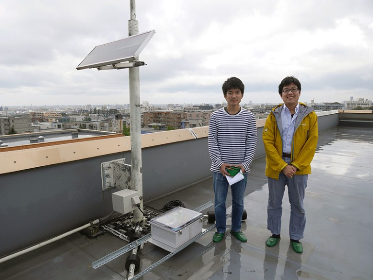 Left, Yuuki Wada and right, Teruaki Enoto at the Kanazawa Izumigaoka high school roof after setting up equipment