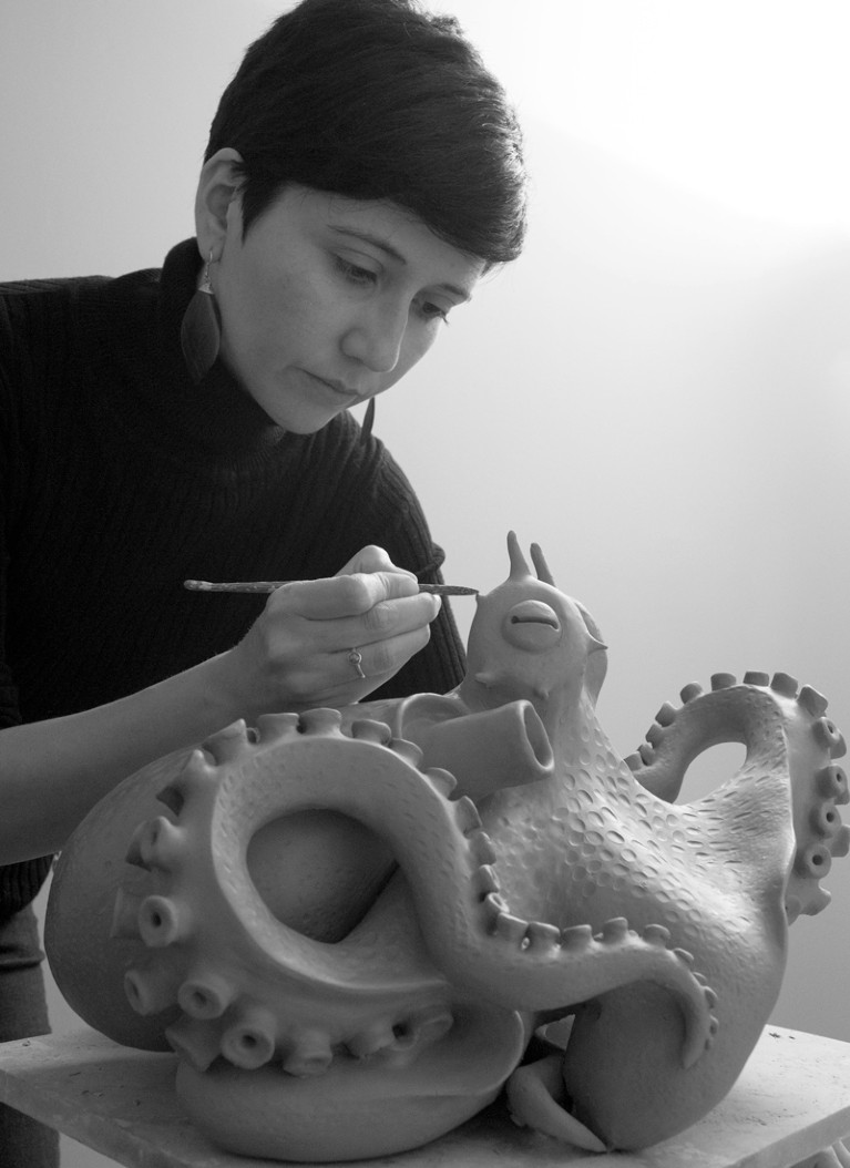 Fernanda Oyarzun working on a sculpture of a coconut-octopus for the series "Marine Consciousness”.