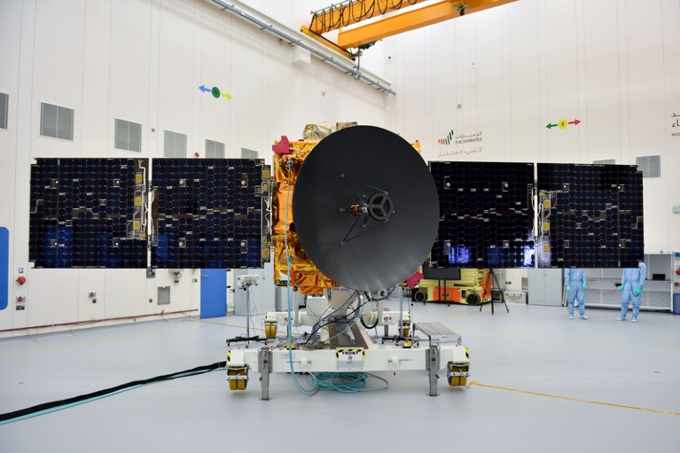 The Hobe Probe with extended solar panels and central satellite dish in a clean room