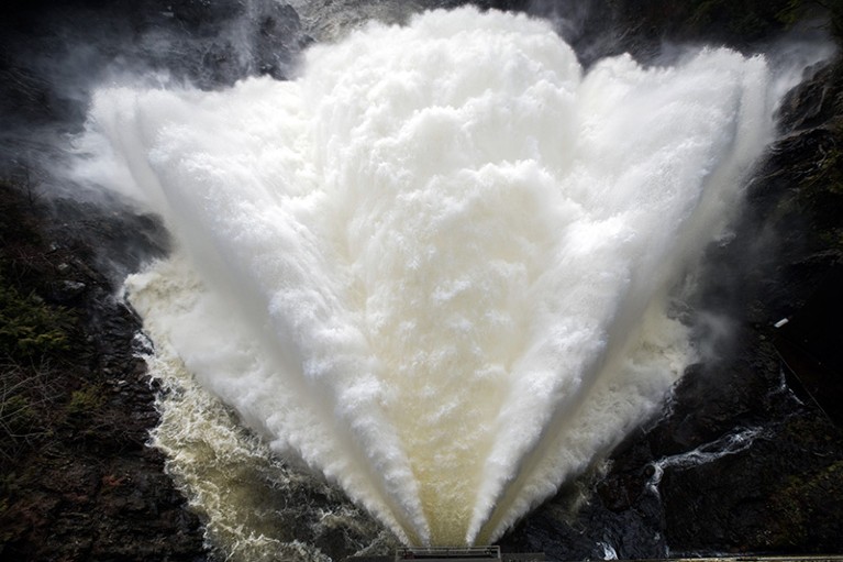 A plume of water sprays from the BC Hydro Jordan River Generating Station dam in Canada