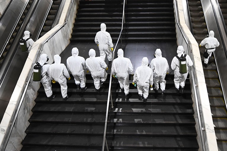 Brazilian soldiers enter the Subway Central Station for its disinfection of coronavirus