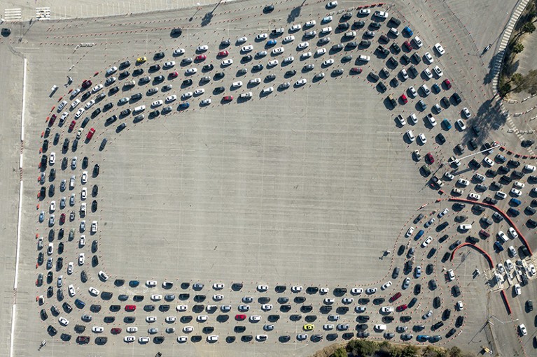 Motorists wait in long lines to take a coronavirus test in Los Angeles