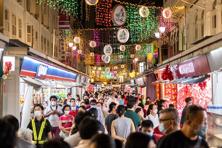 People shop while wearing face masks in Singapore