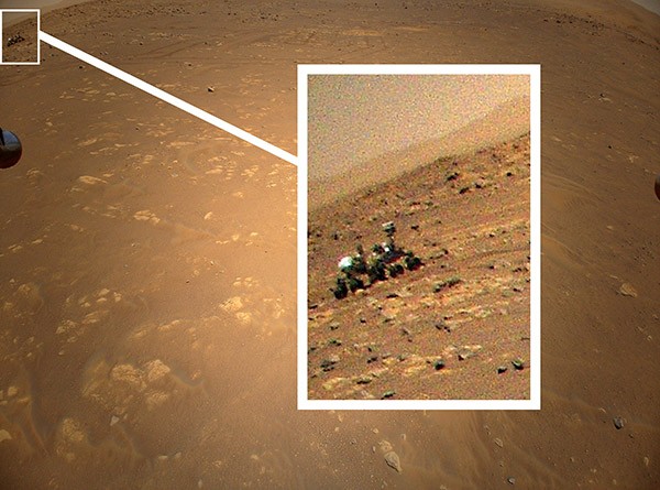 Blown-up detail of an image from Mars shows the Perseverance rover as seen by Ingenuity.