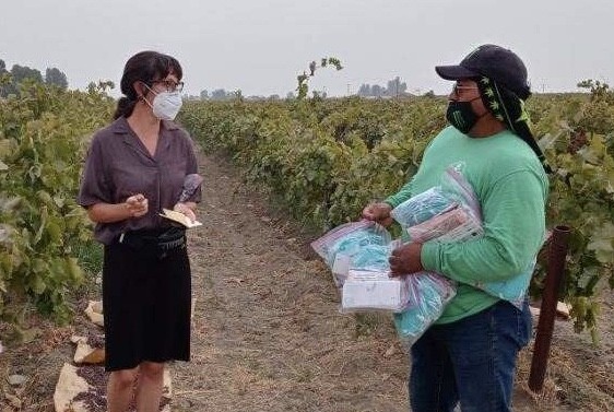 Nature reporter Amy Msxmen interviews an agricultural worker in California.