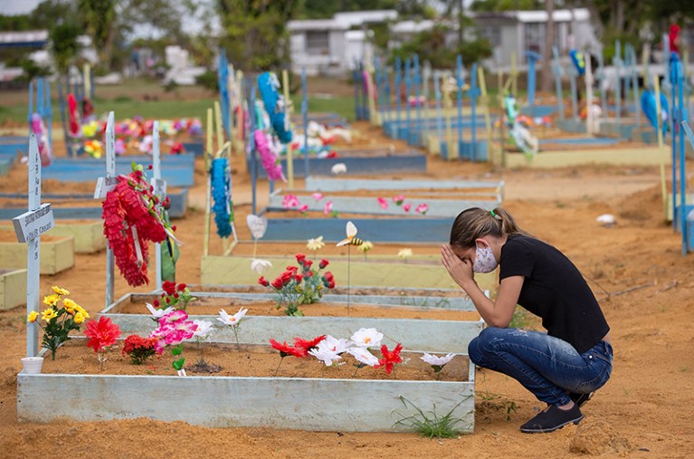 A woman at a grave in Manaus, Amazonas State, Brazil