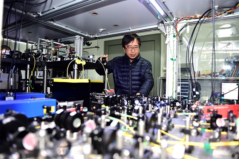 Jian-Wei Pan looks across an array of equipment in his lab