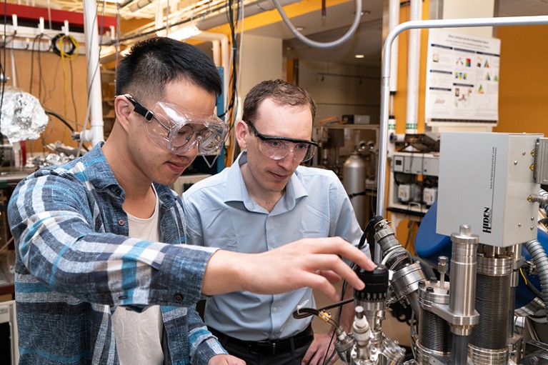 Zachary Ulissi (right) is pictured with Zhitao Guo. They are operating the chemical doser on a ThetaProbe XPS system