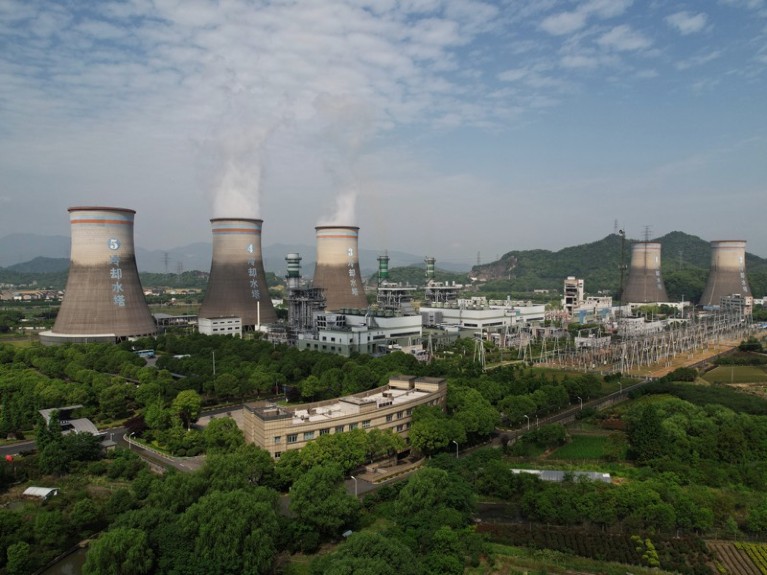 Steam billows out of chimneys of a coal-fired power plant in Hangzhou in east China’ s Zhejiang province.