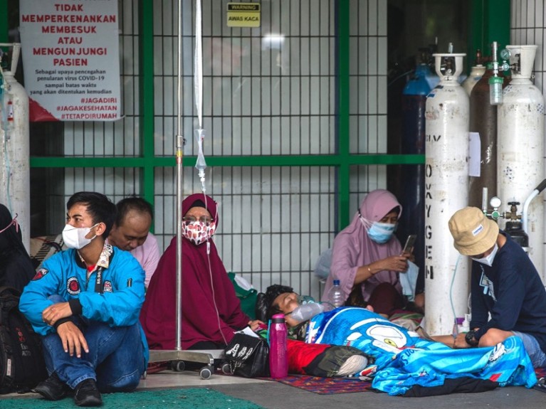 People wait for admission outside the emergency ward of a hospital tending to Covid-19 patients, Indonesia.