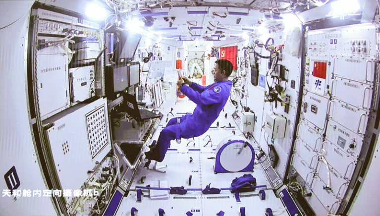 Chinese astronaut Nie Haisheng staying inside Tianhe space module