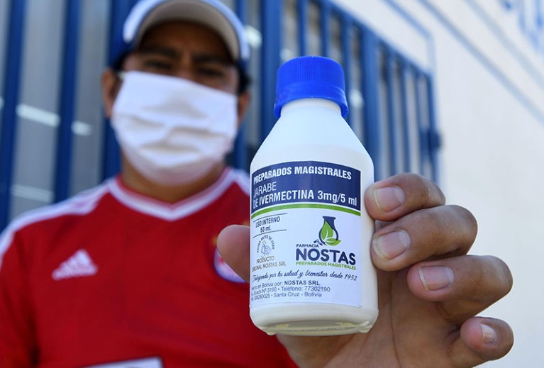 A man holds a bottle of anti-parasite drug ivermectin after buying it in Santa Cruz, Bolivia.