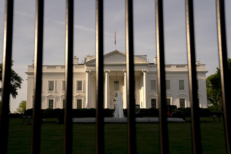 The Presidential White House behind security fencing in Washington, D.C., US.