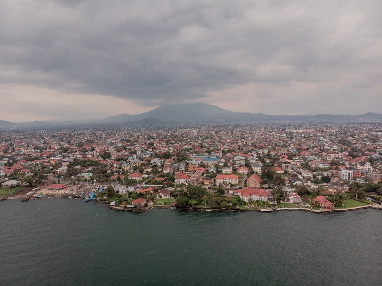 Aerial view of Goma city with Lake Kivu and Nyiragongo Volcano.