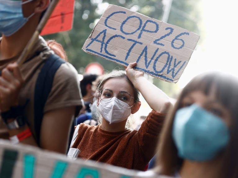 People take part in the 'Global march for climate justice' ahead of Glasgow's COP26 meeting, in Milan, Italy.