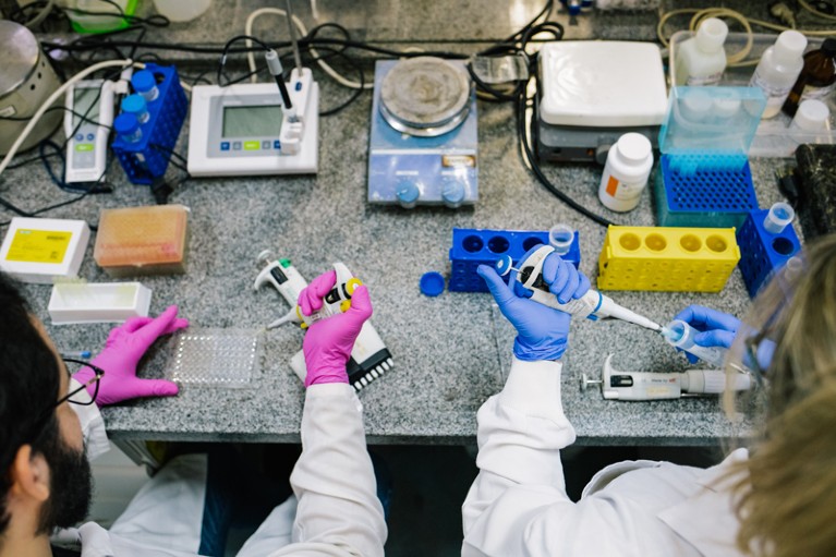 Doctoral researchers working in a lab