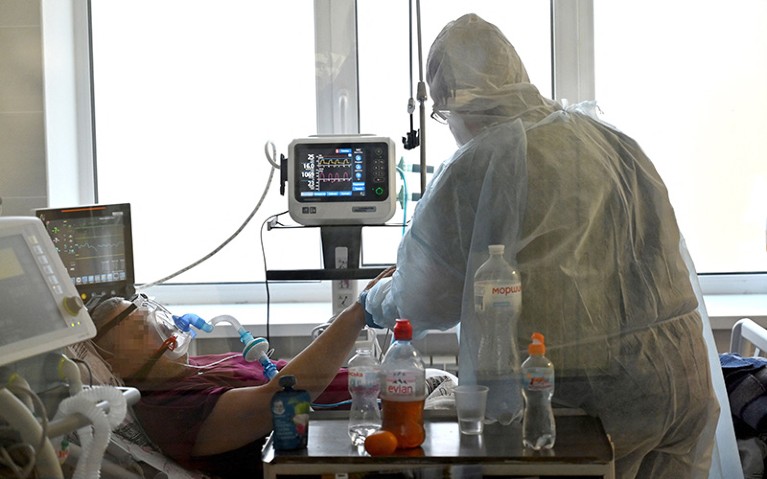 A Heath care worker tends to a Covid-19 patient inside the intensive care unit in a hospital in Ukraine.