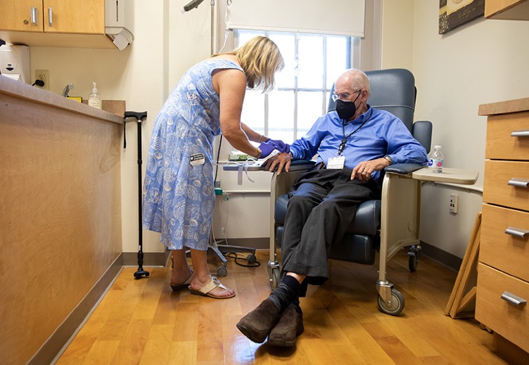 A study participant gets a dose of the experimental Alzheimer's drug aducanumab at a hospital in Rhode Island in May 2021.