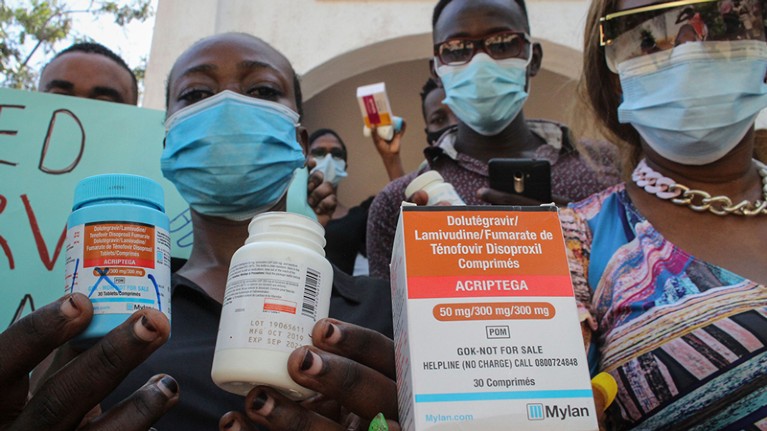 Protesters hold empty containers of anti-retroviral medicines during a demonstration over shortages of ARVs, Kenya.