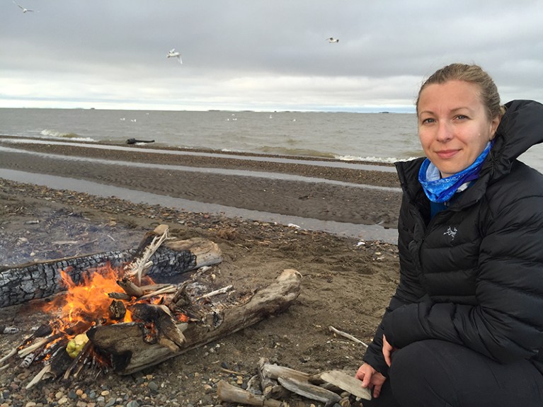 Lisa Loseto at a campfire, where she is shutting down a research site at a traditional whaling camp.
