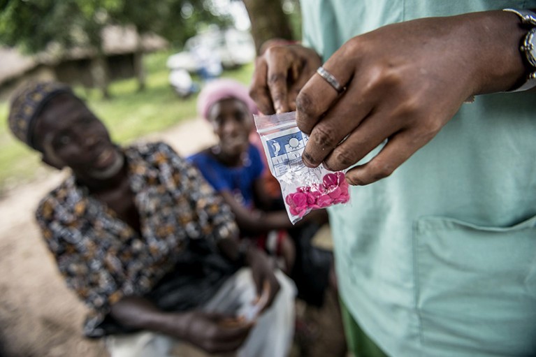 An Ebola survivor receives medication during a MSF outreach mission for survivors of Ebola who suffer long after recovery.