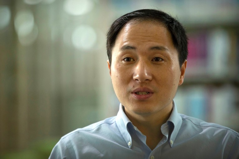 He Jiankui speaks during an interview