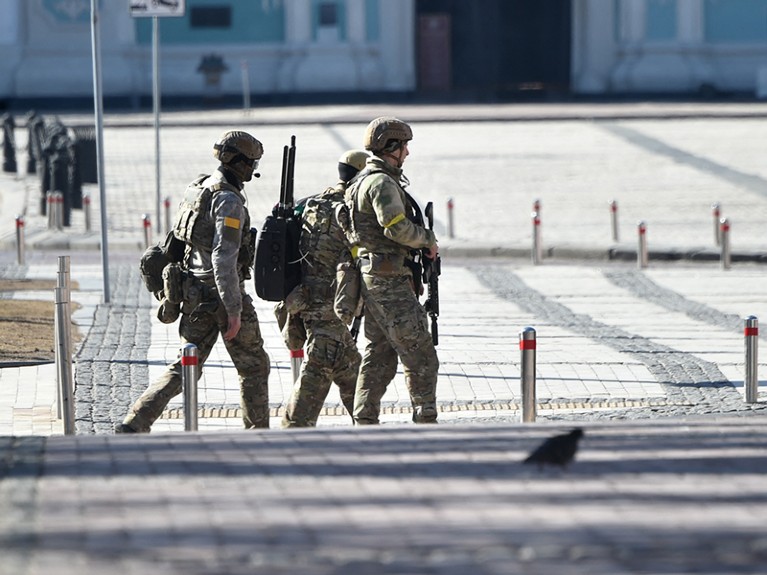 Servicemen of the Ukrainian Military Forces walk in the center of Kyiv on February 28, 2022.