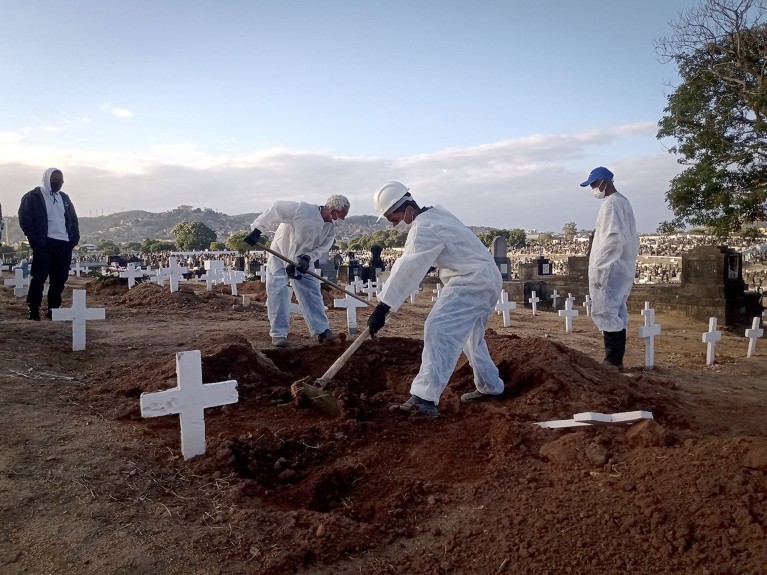 Funeral workers carry out burials of Covid-19 victims at Inhauma Cemetery, north of the city, in Rio de Janeiro, Brazil.