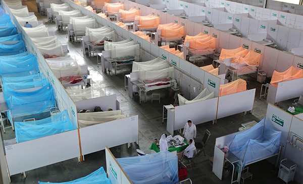 Patients with dengue fever receiving medical treatment at a field hospital in Lahore, Pakistan, in October.