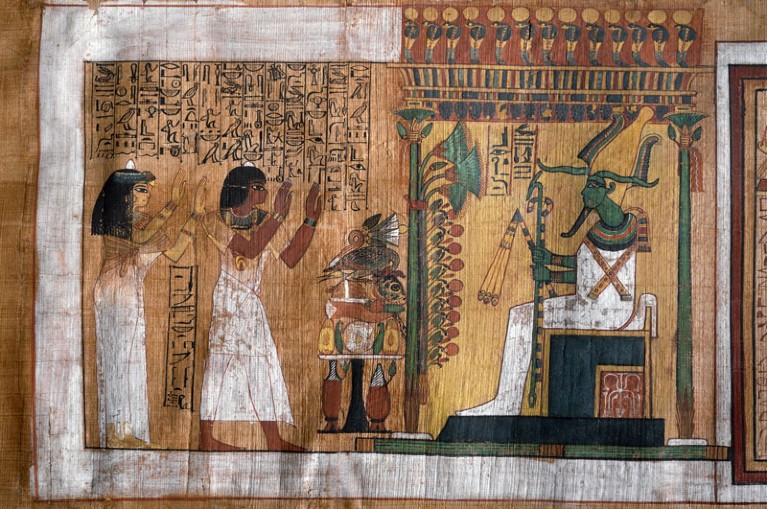 Ancient Egyptian papyrus depicting Kha and his wife Merit worshiping Osiris
