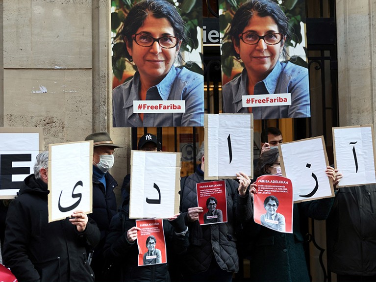 Colleagues of the French-Iranian academic Fariba Adelkhah, hold placards in Paris.